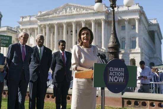 Speaker of the House Nancy Pelosi, D-Calif., and other Democratic lawmakers join activists in support of solutions to climate change as part of President Joe Biden's domestic agenda, at the Capitol in Washington, Wednesday.