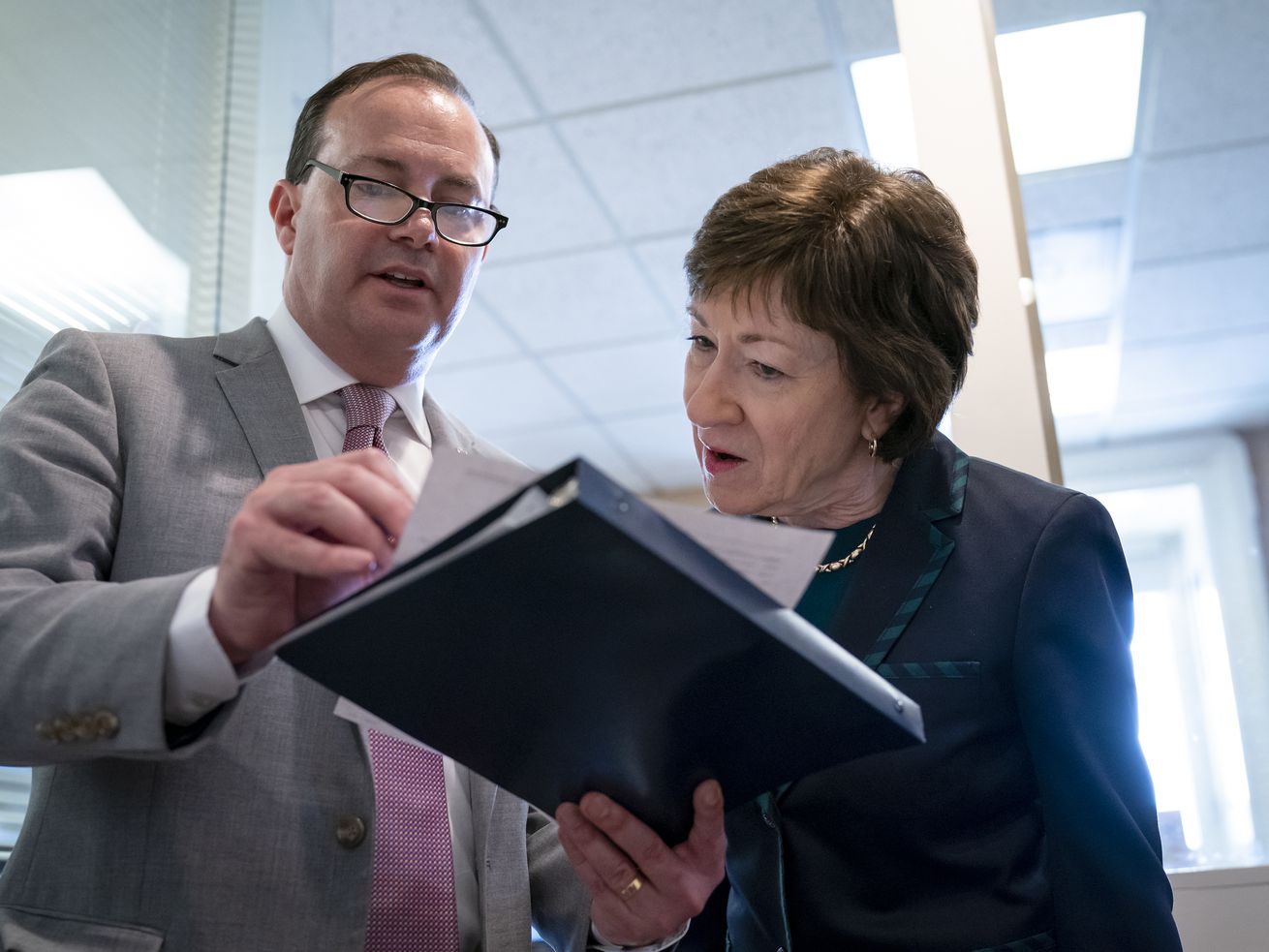 Sen. Mike Lee, R-Utah, and Sen. Susan Collins, R-Maine,
craft an amendment on Feb. 12, 2020, as the Senate advanced a
bipartisan resolution asserting that then President Donald Trump
would have to seek approval from Congress before engaging in
further military action against Iran.