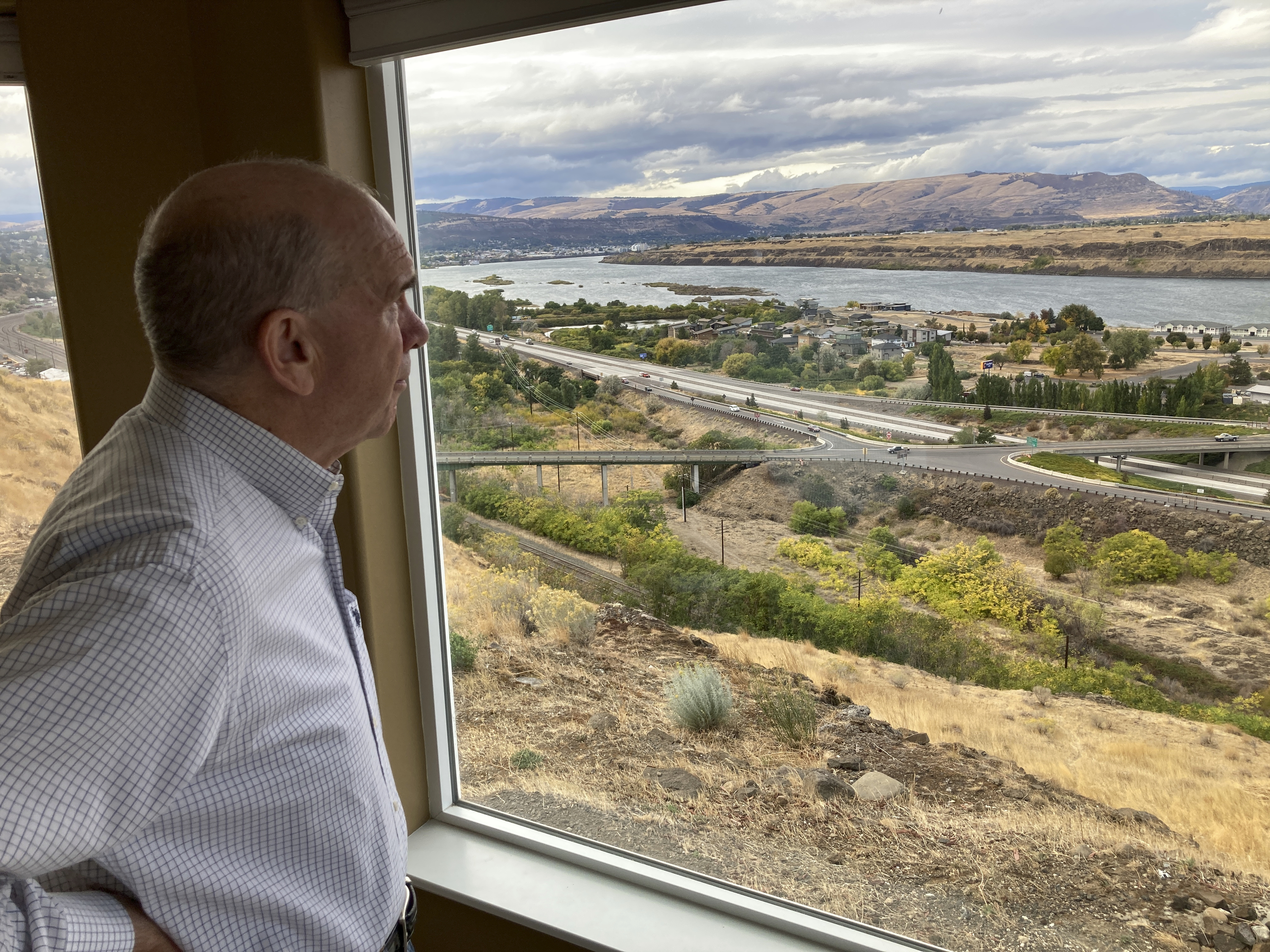 The Dalles Mayor Richard Mays looks at the view of his town and the Columbia River from his hilltop home in The Dalles, Oregon, on Oct. 5. Mays helped negotiate a proposal by Google to build new data centers in the town. The data centers require a lot of water to cool their servers, and would use groundwater and surface water, but not any water from the Columbia River. 