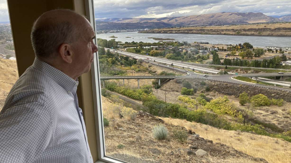 The Dalles Mayor Richard Mays looks at the view of his town and the Columbia River from his hilltop home in The Dalles, Oregon, on Oct. 5. Mays helped negotiate a proposal by Google to build new data centers in the town. The data centers require a lot of water to cool their servers, and would use groundwater and surface water, but not any water from the Columbia River.
