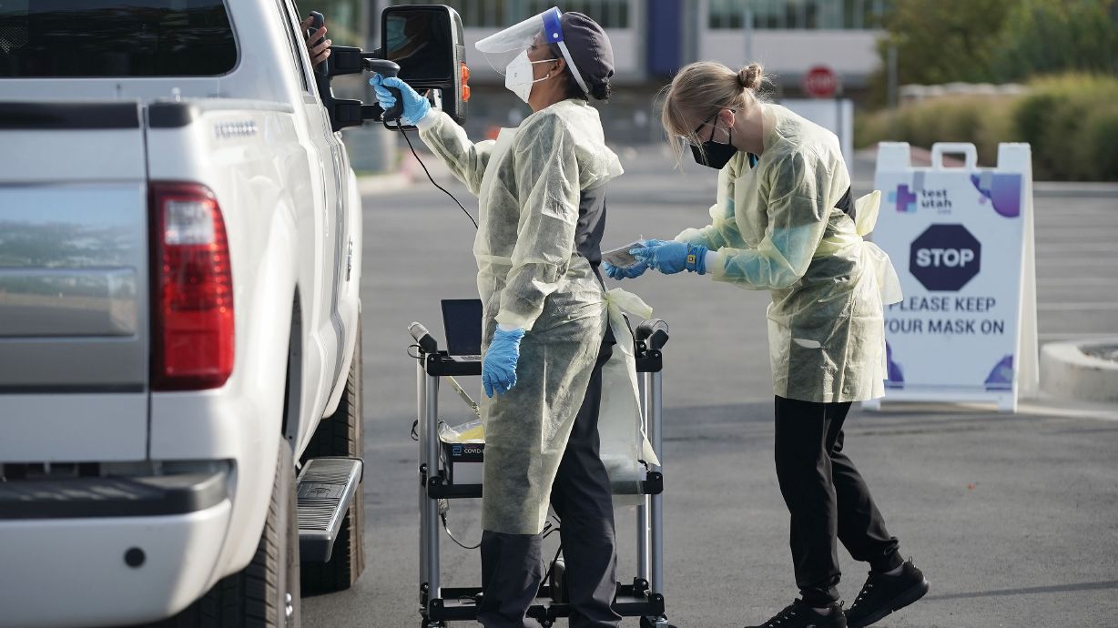 A person is tested by Nomi Health for COVID-19 at Cottonwood Heights City Hall parking lot on Sept. 30. The Utah Department of Health reported 1,250 new COVID-19 cases and 11 deaths on Tuesday.