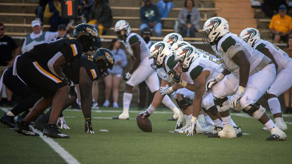 Southern Mississippi, left, and UAB face off at the line of scrimmage during the third quarter of an NCAA college football game in Hattiesburg, Miss., Saturday, Oct. 16, 2021.