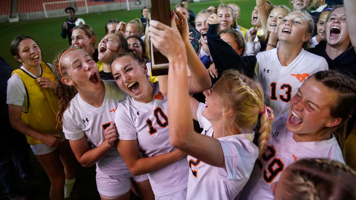Mountain Crest soccer team cheers after winning the 4A girls soccer state championship game against Crimson Cliffs on Friday, Oct. 22, 2021 at Rio Tinto Stadium in Sandy .