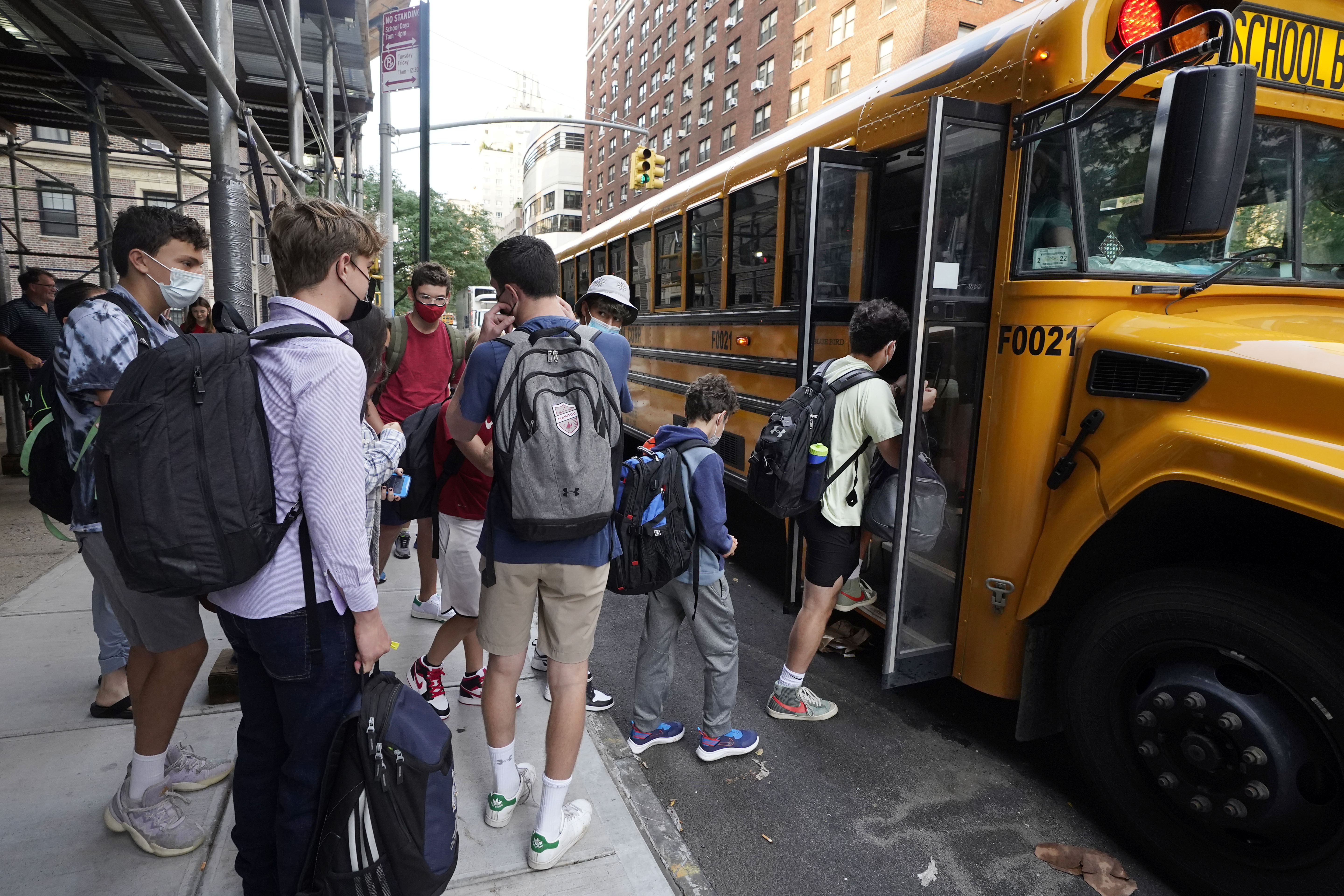 Students board a school bus on New York's Upper West Side. 