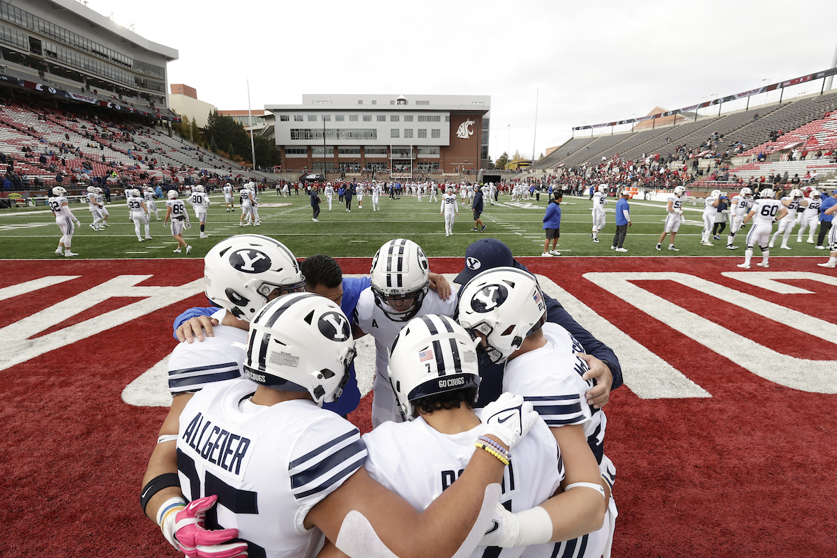 BYU players huddle before a game against Washington State, Saturday, Oct. 23, 2021 in Pullman, Washington.