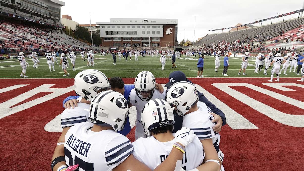 BYU players huddle before a game against Washington State, Saturday, Oct. 23, 2021 in Pullman, Washington.