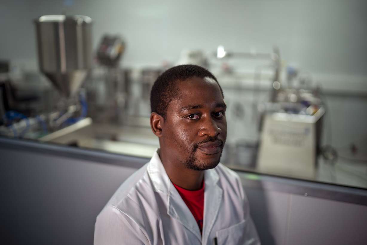 Donald Mjonono, an engineer at Afrigen Biologics and Vaccines in Cape Town, South Africa, poses Oct. 19. In a pair of warehouses converted into labs, a team of Afrigen scientists is assembling the equipment needed to reverse engineer Moderna's coronavirus vaccine.