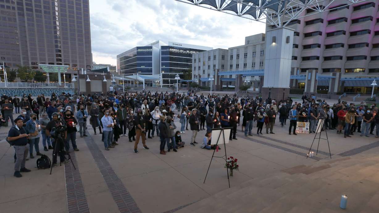 A large crowd of movie industry workers and New Mexico residents attend a candlelight vigil to honor cinematographer Halyna Hutchins in downtown Albuquerque, N.M., on Oct. 23.