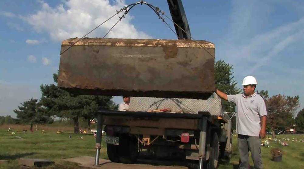 In this undated photo provided by the Cook County Sheriff's Office, authorities exhume a box with the remains of unidentified victims of serial killer John Wayne Gacy, who was convicted of killing 33 young men and boys in the Chicago area in the 1970s. Authorities announced Monday that they have identified the remains of one more of Gacy's victims.
