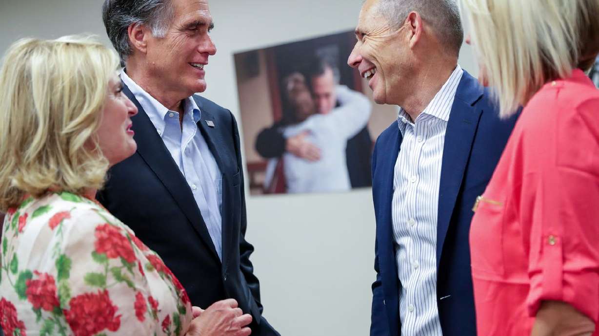 Ann Romney, left, Sen. Mitt Romney, R-Utah, Rep. John
Curtis, R-Utah, and Sue Curtis, right, chat after they each claimed
victory in their primary elections in Orem on June 26, 2018.