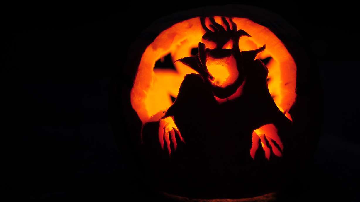 Why am I a scaredy-cat and you're not? The science of fright. A carved pumpkin stands on a ledge in front of house ahead of Halloween in Montague, Massachusetts in October 2011.