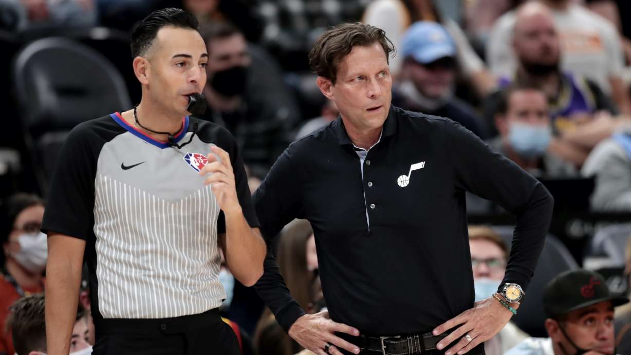 Utah Jazz head coach Quin Snyder, talks with referee Ray Acosta (54) as the Utah Jazz and the Oklahoma City Thunder, open the 2021-22 season at Vivint Arena in Salt Lake City on Wednesday, Oct. 20, 2021.