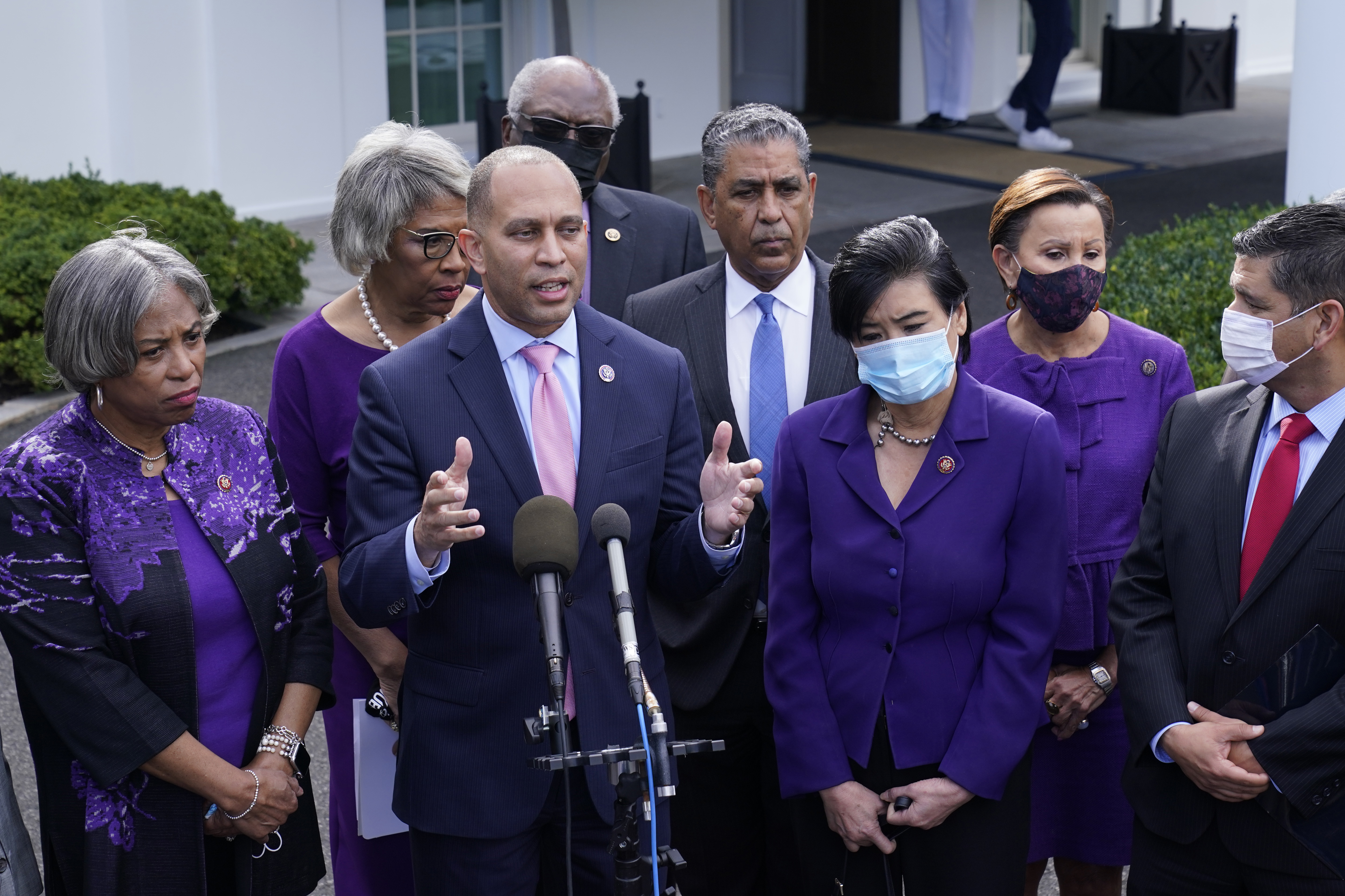 Rep. Hakeem Jeffries, D-N.Y., standing with other House Democrats, talks to reporters outside the West Wing of the White House in Washington on Oct. 26, following a meeting with President Joe Biden to work out details of the Biden administration's domestic agenda.