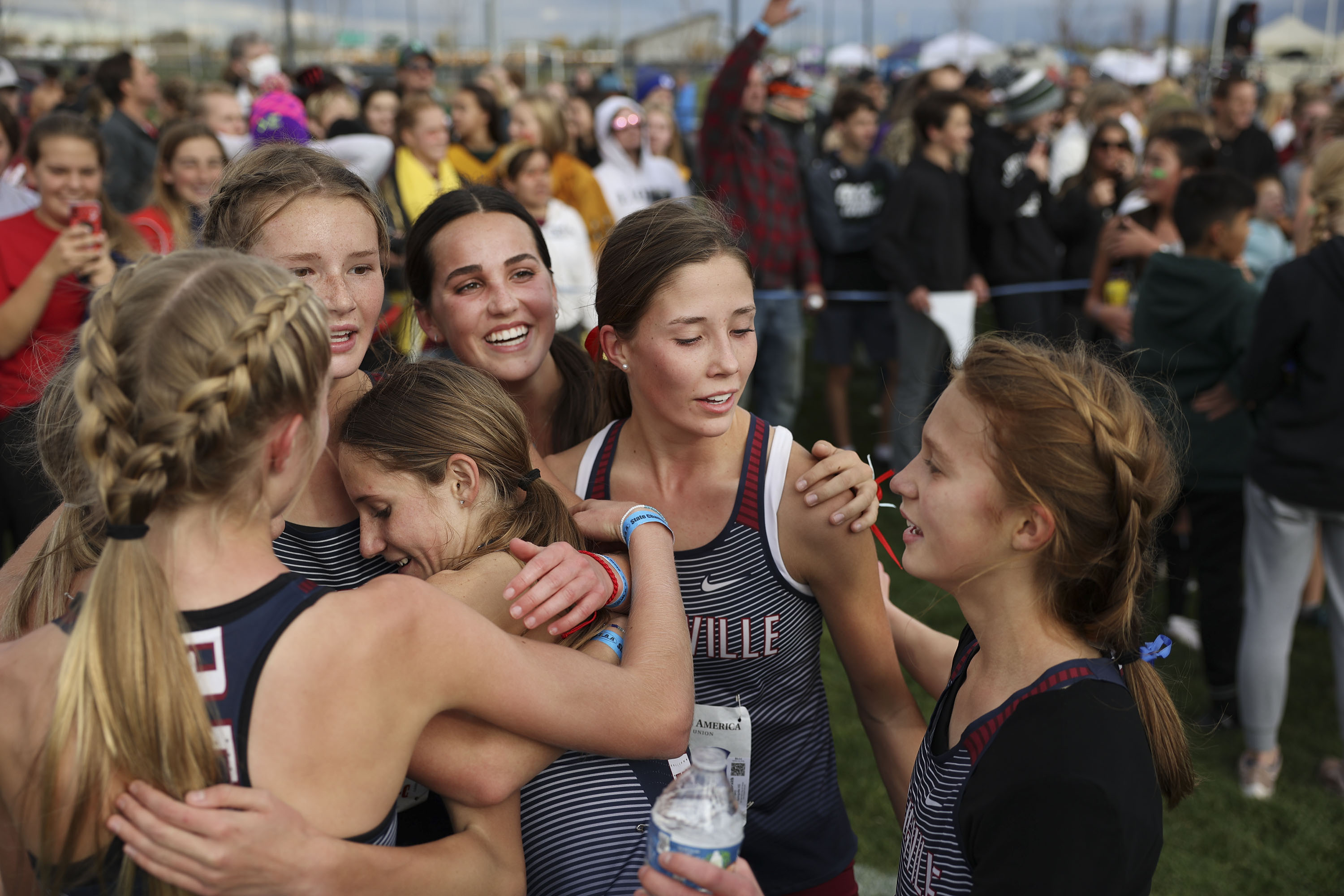 Springville girls celebrate their 5A girls cross-country state championships at the Regional Athletic Complex in Salt Lake City on Wednesday, Oct. 27, 2021.