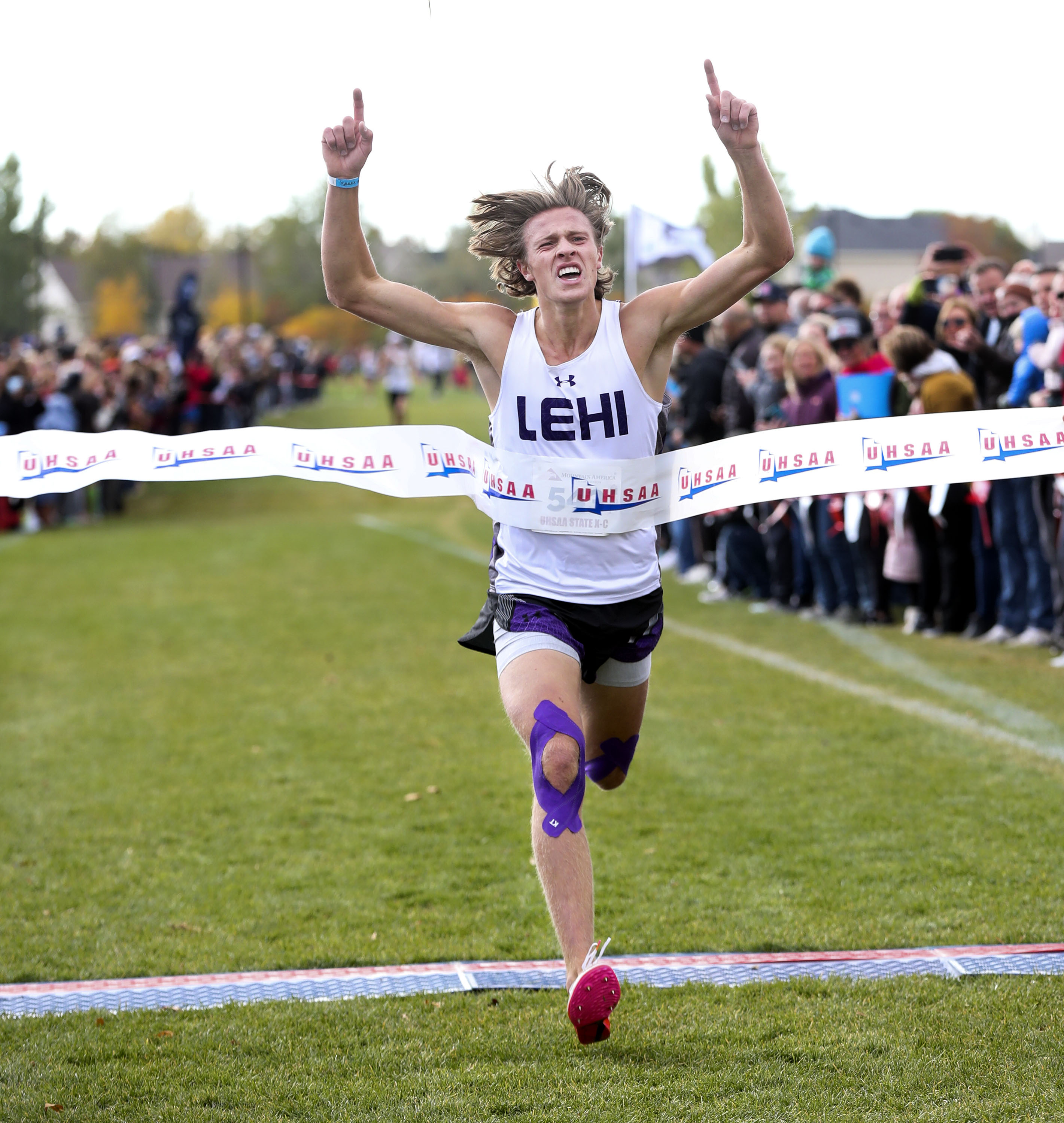 Lehi’s Jefferson McMullin crosses the finish line in first place in the 5A boys cross-country state championships at the Regional Athletic Complex in Salt Lake City on Wednesday, Oct. 27, 2021.