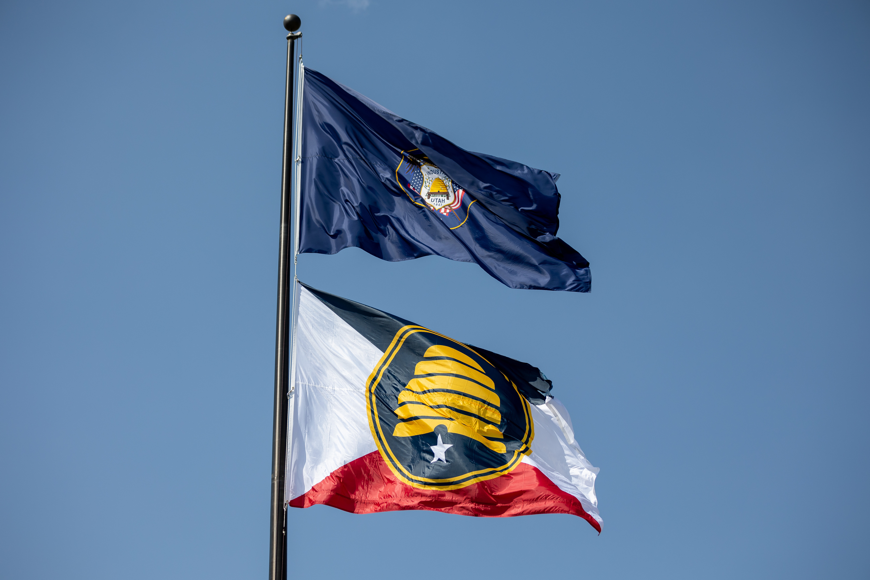 The Utah state flag, top, and the new commemorative state flag, below, fly atop the Capitol in Salt Lake City on July 13. Utah State Flag Task Force hammered out a new, detailed timeline for the process for a new Utah state flag on Monday.