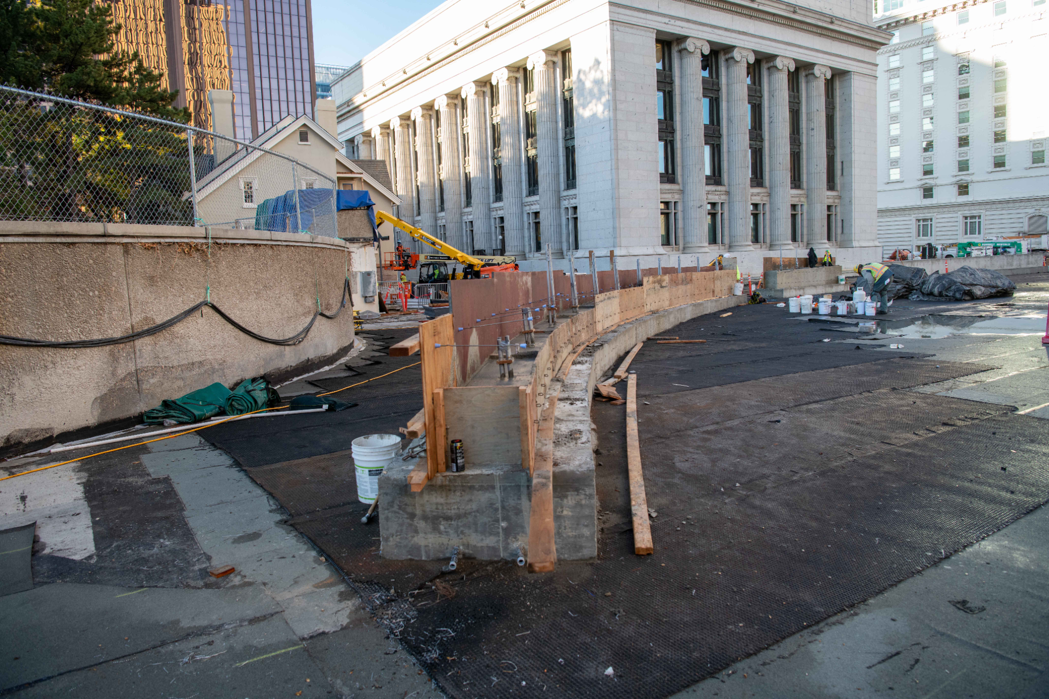 The makings of a new concrete elliptical structure, in Salt Lake City in October, on the southeast side of the Church Office Building plaza where country flags will be displayed.