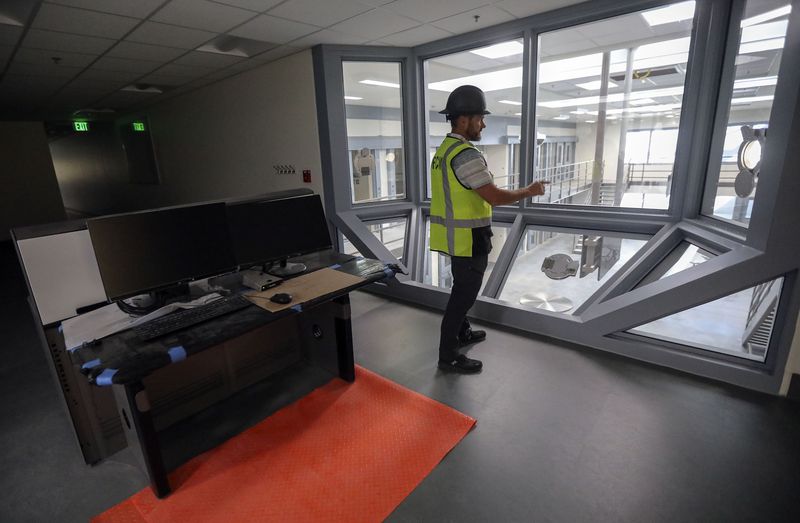 Michael Ambre, assistant director of the state Division
of Facilities Construction and Management, shows the view into a
maximum security men’s unit from a control room in the new Utah
State Prison in Salt Lake City on Thursday, Oct. 21. A guard
can lock or unlock doors from the control room.