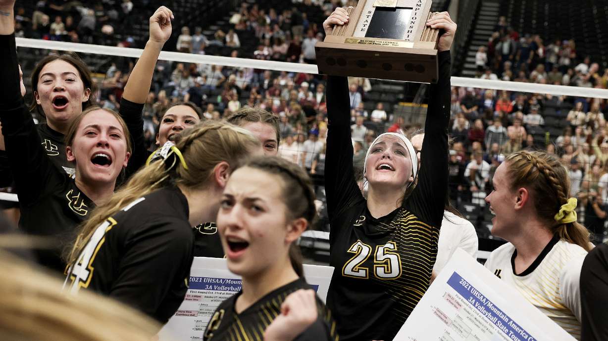 Union High School players celebrates their 3A volleyball state championship game against Morgan High at Utah Valley University in Orem on Thursday, Oct. 28, 2021.