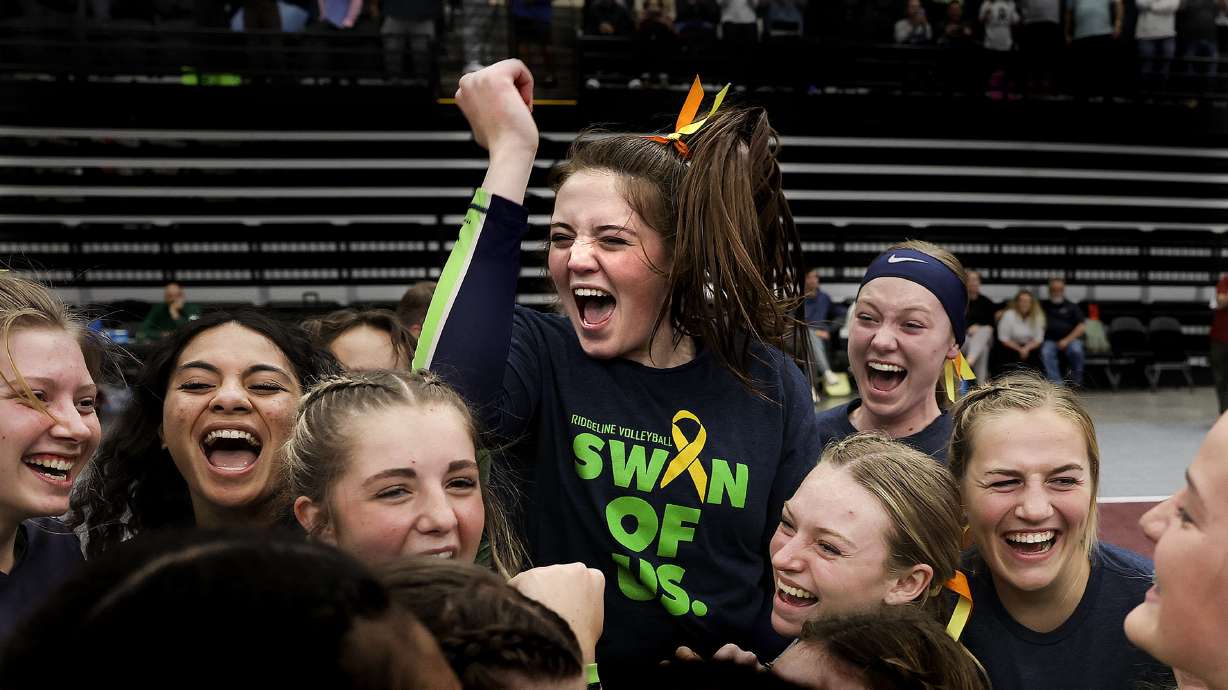 Ridgeline celebrates their 4A volleyball state championship win against Desert Hills at Utah Valley University in Orem on Thursday, Oct. 28, 2021.