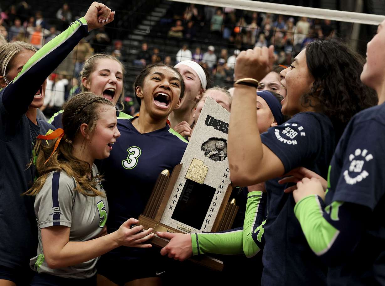 Ridgeline celebrates their 4A volleyball state championship win against Desert Hills at Utah Valley University in Orem on Thursday, Oct. 28, 2021.