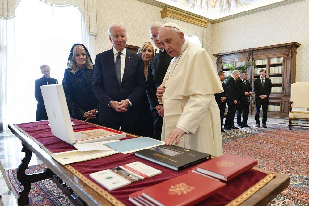 President Joe Biden and first lady Jill Biden exchange gifts with Pope Francis as they meet at the Vatican, Friday. President Joe Biden is set to meet with Pope Francis on Friday at the Vatican, where the world’s two most notable Roman Catholics plan to discuss the COVID-19 pandemic, climate change and poverty. The president takes pride in his Catholic faith, using it as moral guidepost to shape many of his social and economic policies.