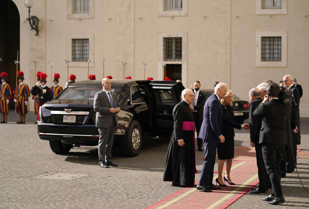 U.S. President Joe Biden and first lady Jill Biden, center, are greeted as they arrive for a meeting with Pope Francis at the Vatican, Friday. A Group of 20 summit scheduled for this weekend in Rome is the first in-person gathering of leaders of the world's biggest economies since the COVID-19 pandemic started.