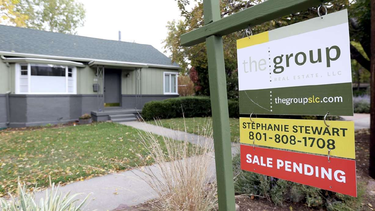 A "for sale” sign and "sale pending” sign are pictured in Salt Lake City on Monday, Oct. 18. Housing affordability is a serious issue in Utah.