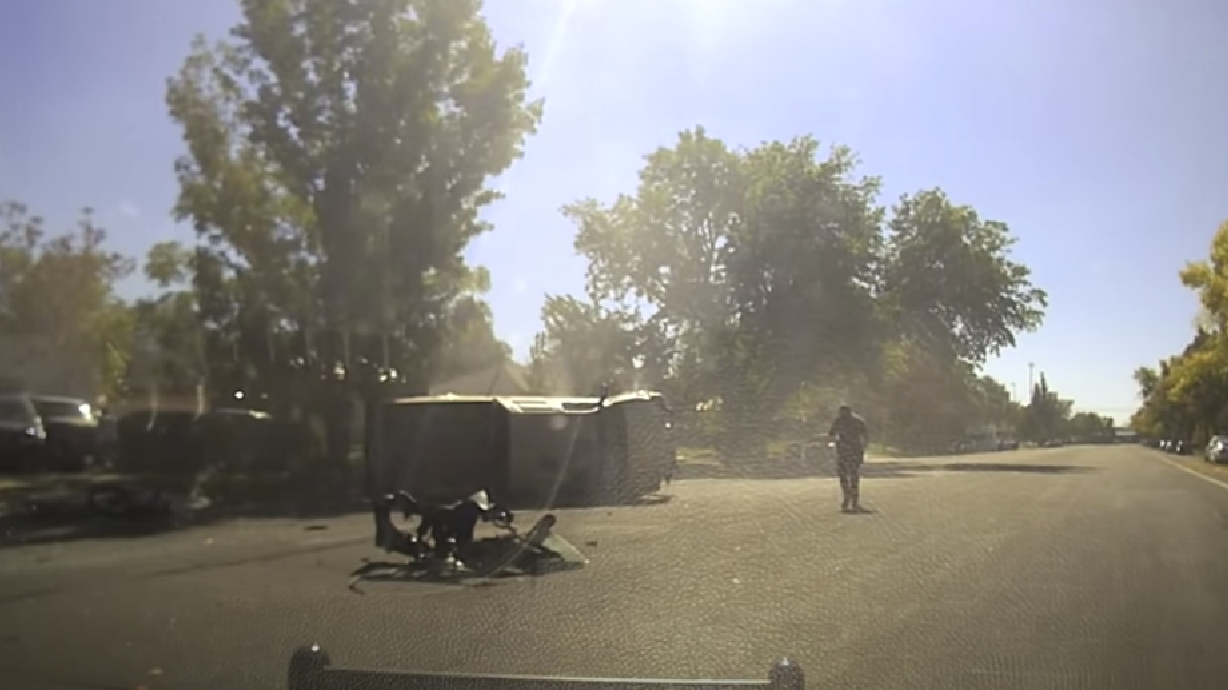 A screenshot from dashcam video shows an overturned truck seconds after it collided with another vehicle in Salt Lake City on Oct. 16, killing the owner of Mims Bakery and critically injuring another woman. The West Jordan driver was allegedly fleeing police when the crash occurred and was charged Friday with manslaughter.