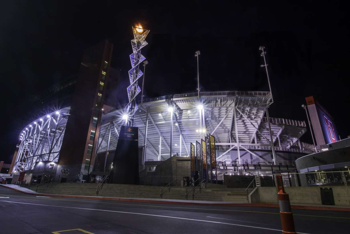 The 2002 Winter Olympics cauldron burns brightly outside of Rice-Eccles Stadium in Salt Lake City Friday. The 72-foot cauldron not rests on a pedal water fountain outside of the stadium.