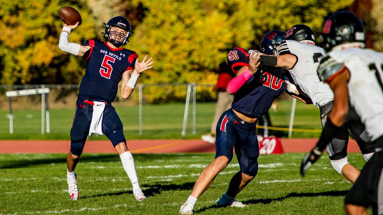 Springville quarterback Ryder Burton completes a pass during the Red Devils' 5A second-round playoff game against Alta, Friday, Oct. 29, 2021 in Springville.