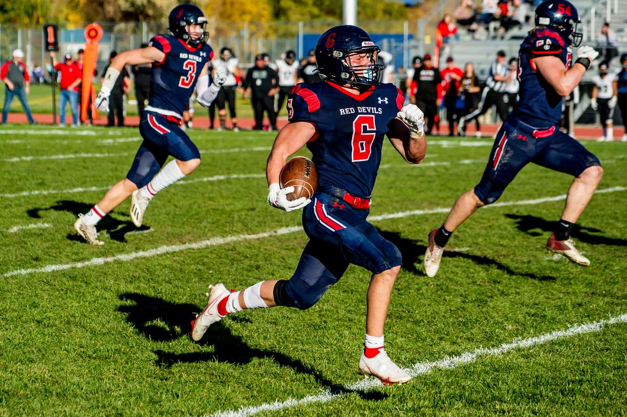 Springville running back Seth Rigtrup races for a touchdown during the Red Devils' 5A second-round playoff game against Alta, Friday, Oct. 29, 2021 in Springville.