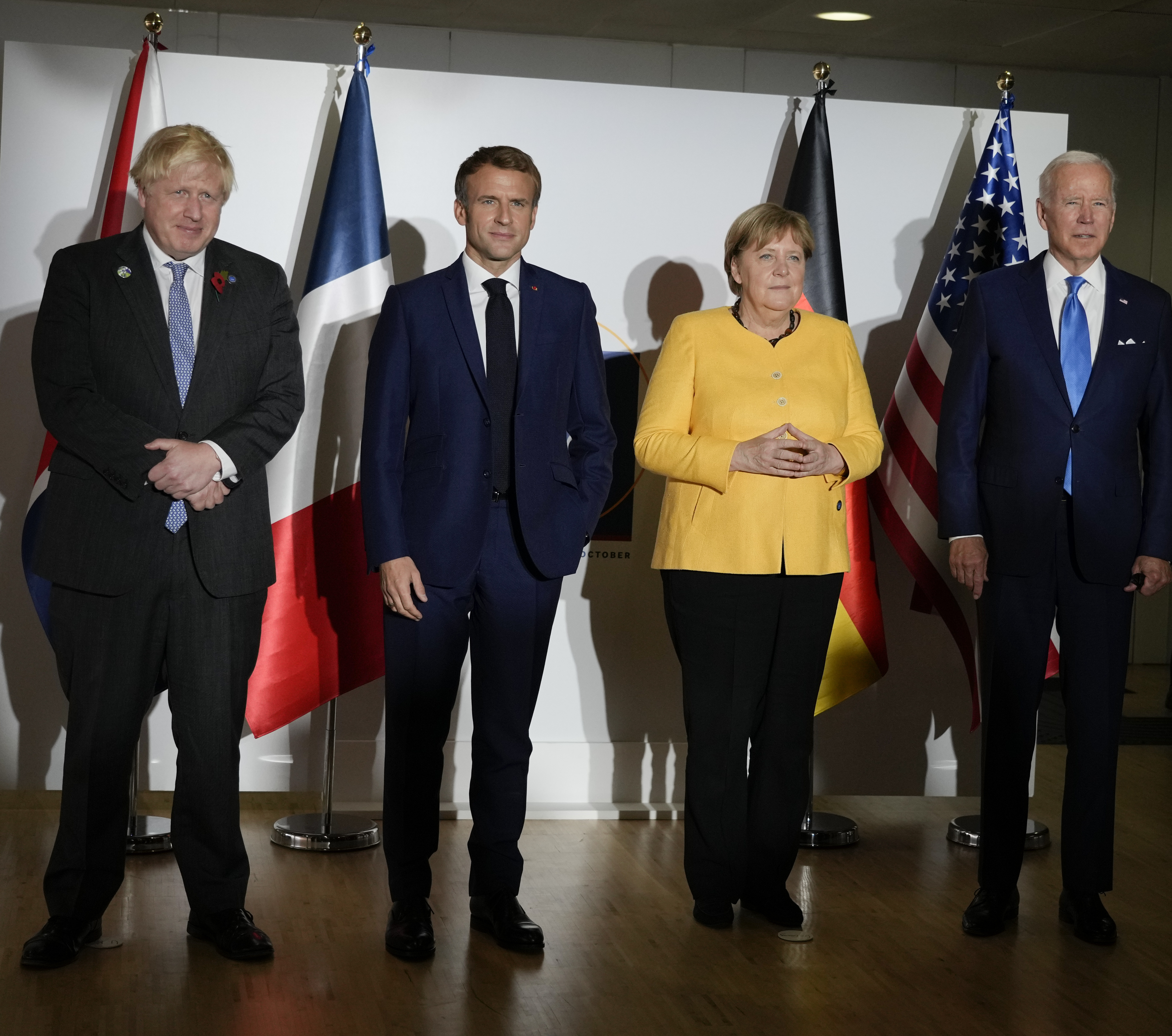 British Prime Minister Boris Johnson, French President Emmanuel Macron, German Chancellor Angela Merkel, and U.S. President Joe Biden, from left, pose for the media prior to a meeting at the La Nuvola conference center for the G20 summit in Rome on Saturday. The two-day Group of 20 summit is the first in-person gathering of leaders of the world's biggest economies since the COVID-19 pandemic started.