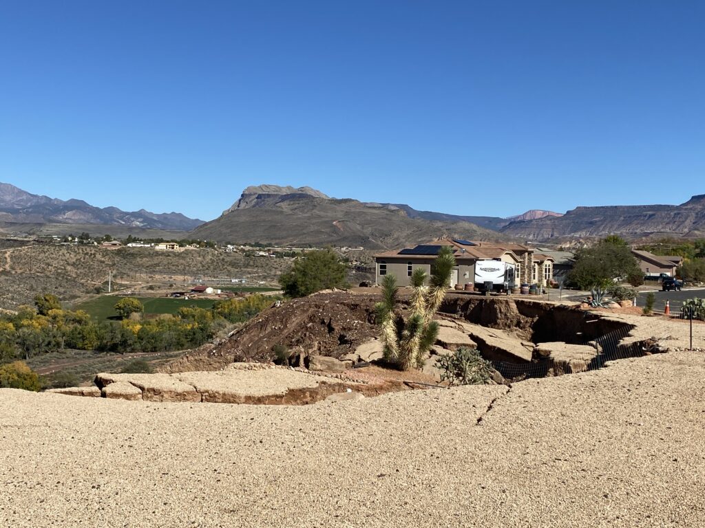 Landscaping and plant life are the last signs of two homes that were lost to an ongoing landslide in La Verkin, Washington County, on Wednesday.