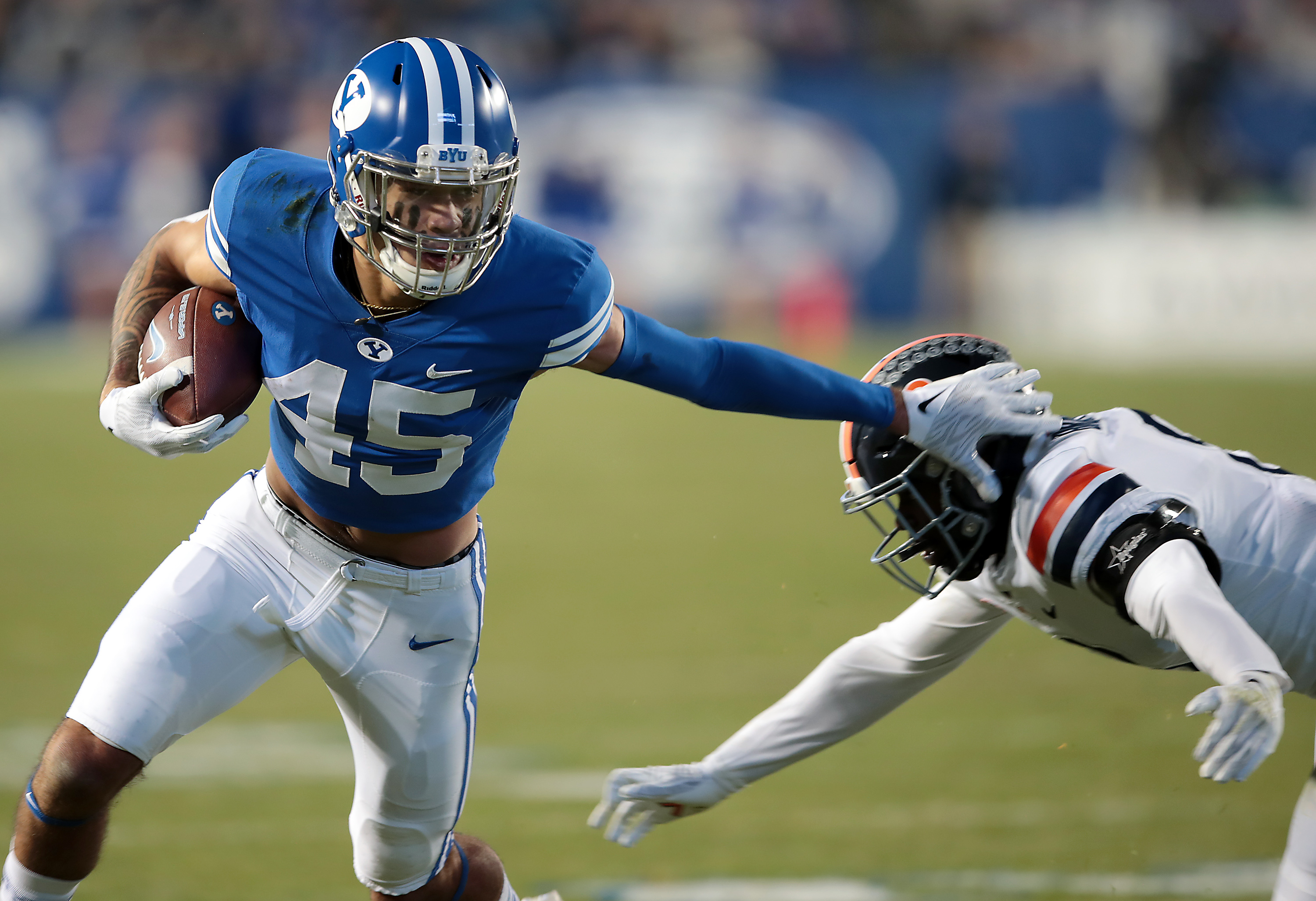 BYU wide receiver Samson Nacua (45) pushes Virginia cornerback Darrius Bratton (8) aside after a catch as BYU and Virginia prepare to play at LaVell Edwards stadium in Provo on Saturday, Oct. 30, 2021.