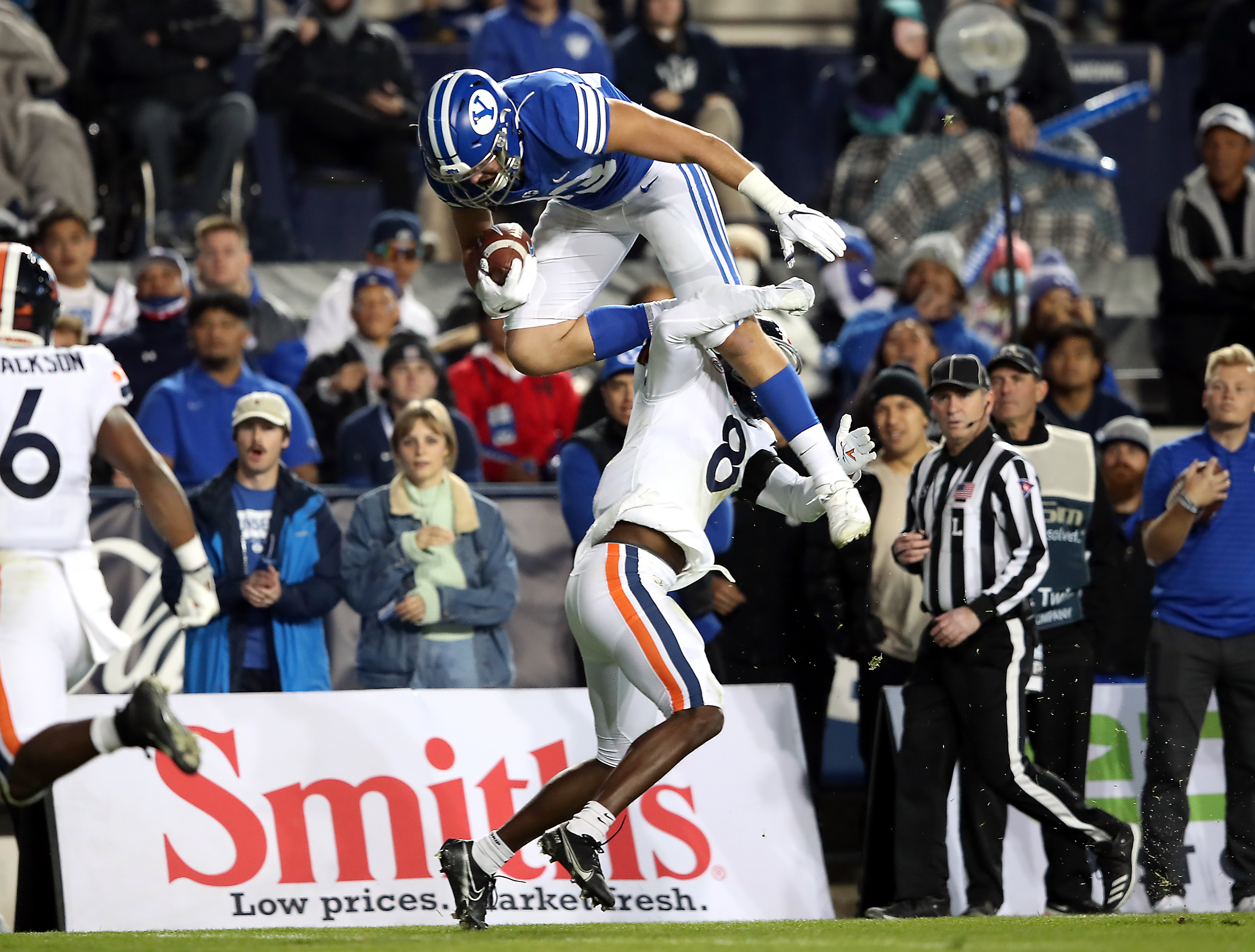 BYU tight end Isaac Rex (83) is hit by Virginia cornerback Darrius Bratton (8) as he tries to hurdle as BYU and Virginia prepare to play at LaVell Edwards stadium in Provo on Saturday, Oct. 30, 2021.