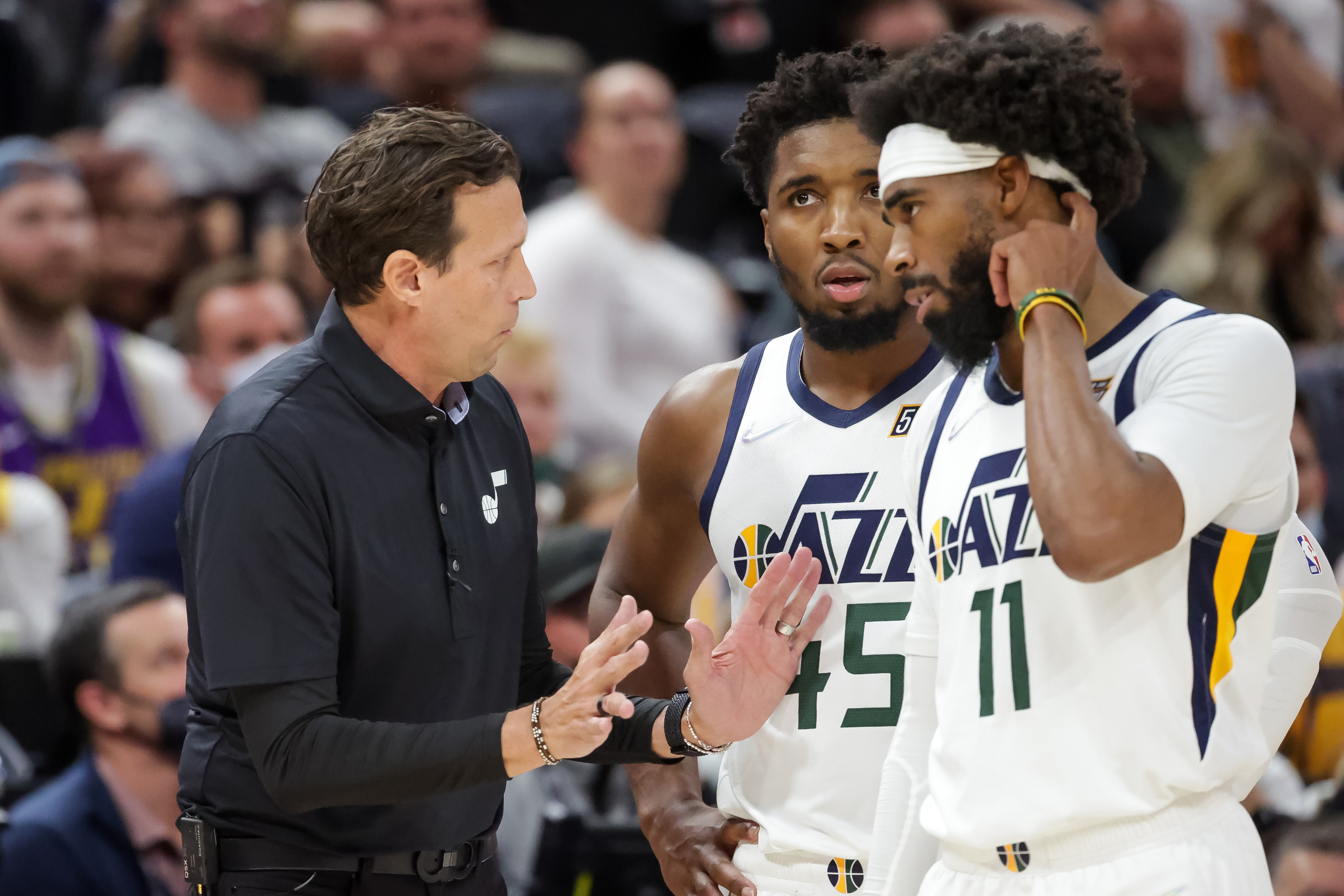 Utah Jazz head coach Quin Snyder talks to guard Donovan Mitchell (45) and guard Mike Conley (11) during the game against the Denver Nuggets at Vivint Arena in Salt Lake City on Tuesday, Oct. 26, 2021.

