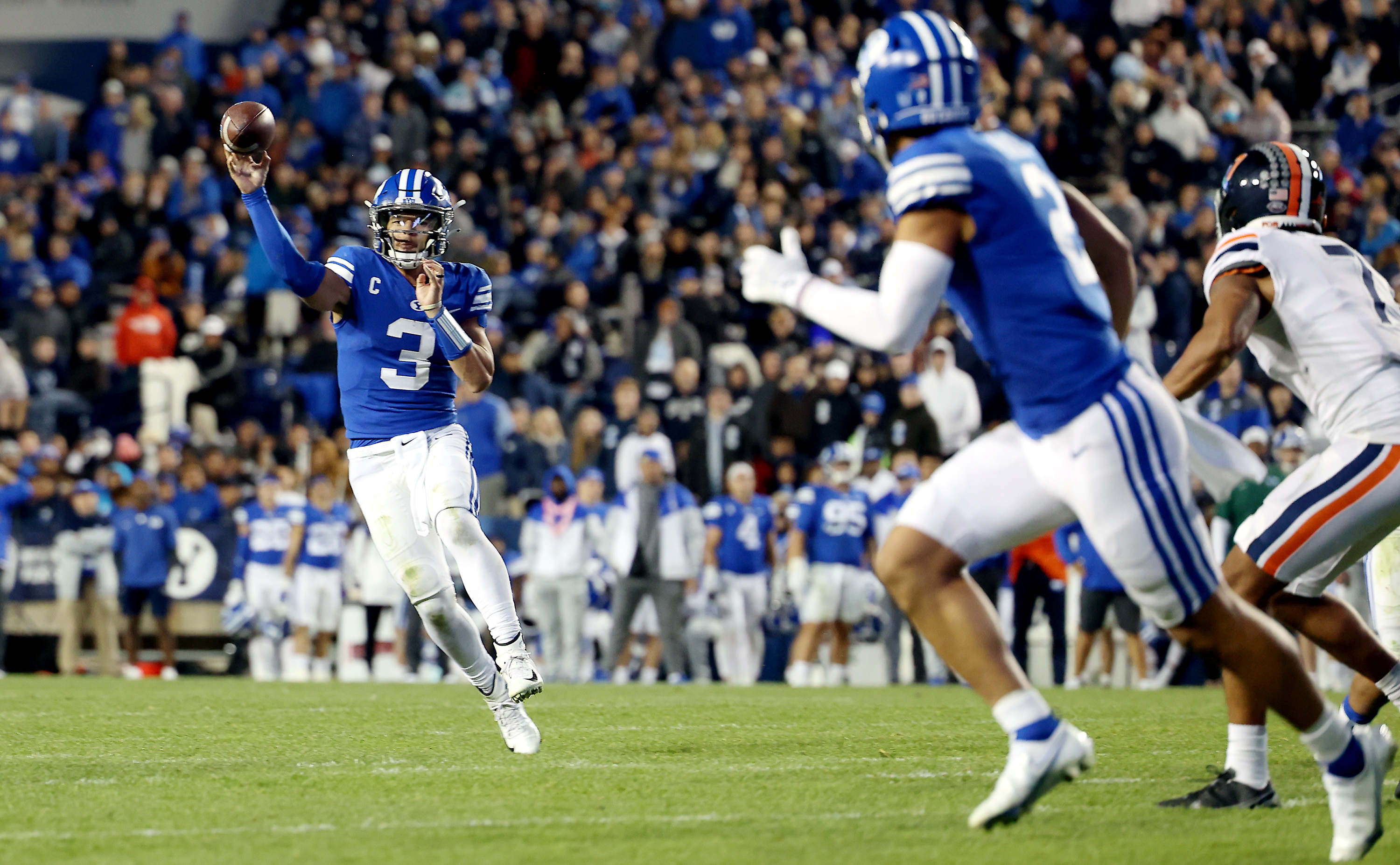 Brigham Young Cougars quarterback Jaren Hall (3) delivers a pass to Brigham Young Cougars wide receiver Neil Pau'u (2) for a touchdown as BYU and Virginia play at LaVell Edwards stadium in Provo on Saturday, Oct. 30, 2021. BYU won 66-49.