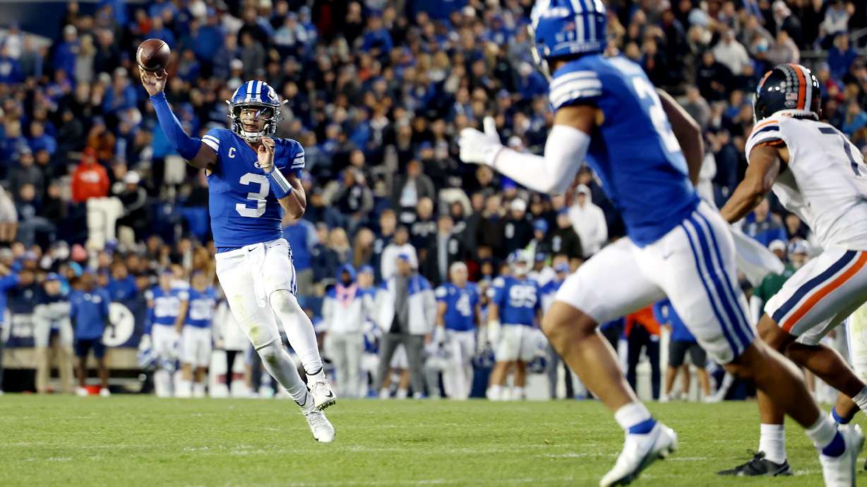 Brigham Young Cougars quarterback Jaren Hall (3) delivers a pass to Brigham Young Cougars wide receiver Neil Pau'u (2) for a touchdown as BYU and Virginia play at LaVell Edwards stadium in Provo on Saturday, Oct. 30, 2021. BYU won 66-49.