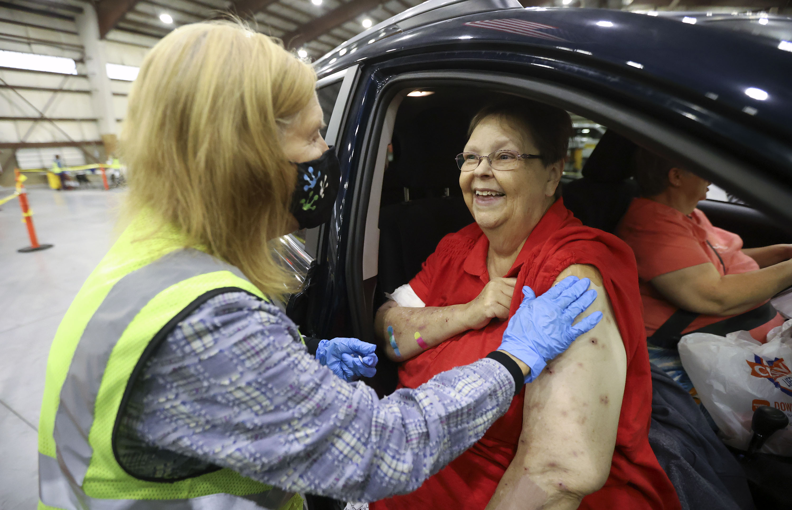 Davis County community health nurse Debbie Patton gives Christine Cunningham, of Farmington, a COVID-19 booster shot at the Legacy Events Center in Farmington on Oct. 25. The Utah Department of Health reported 3,179 new cases since Friday.