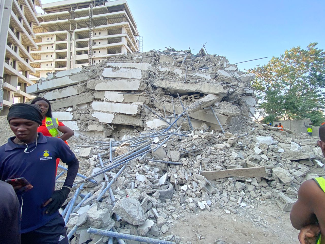 People are feared to be trapped in the ruins of a 22-story building that collapsed in an upmarket area of Nigeria's economic hub, Lagos, on Monday.