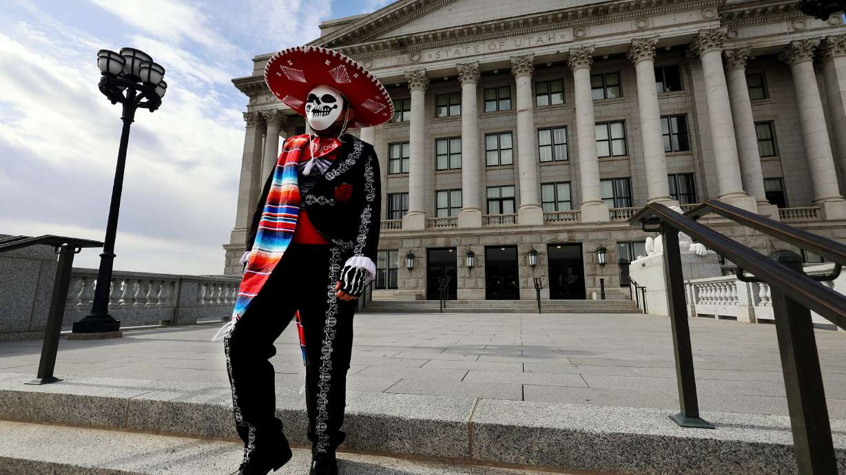 Marco Munoz walks to his car after a remembrance event in honor of Día de los Muertos (Day of the Dead) in the Hall of Governors at the Capitol in Salt Lake City on Monday.