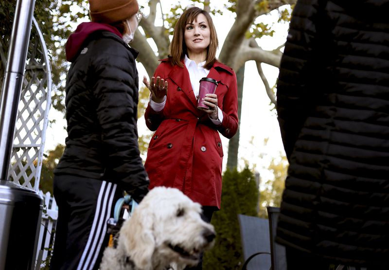 Republican Ally Isom, who is a candidate in the race
for the U.S. Senate, speaks with visitors to Caffé Torino in
Farmington on Friday, Oct. 29, 2021.