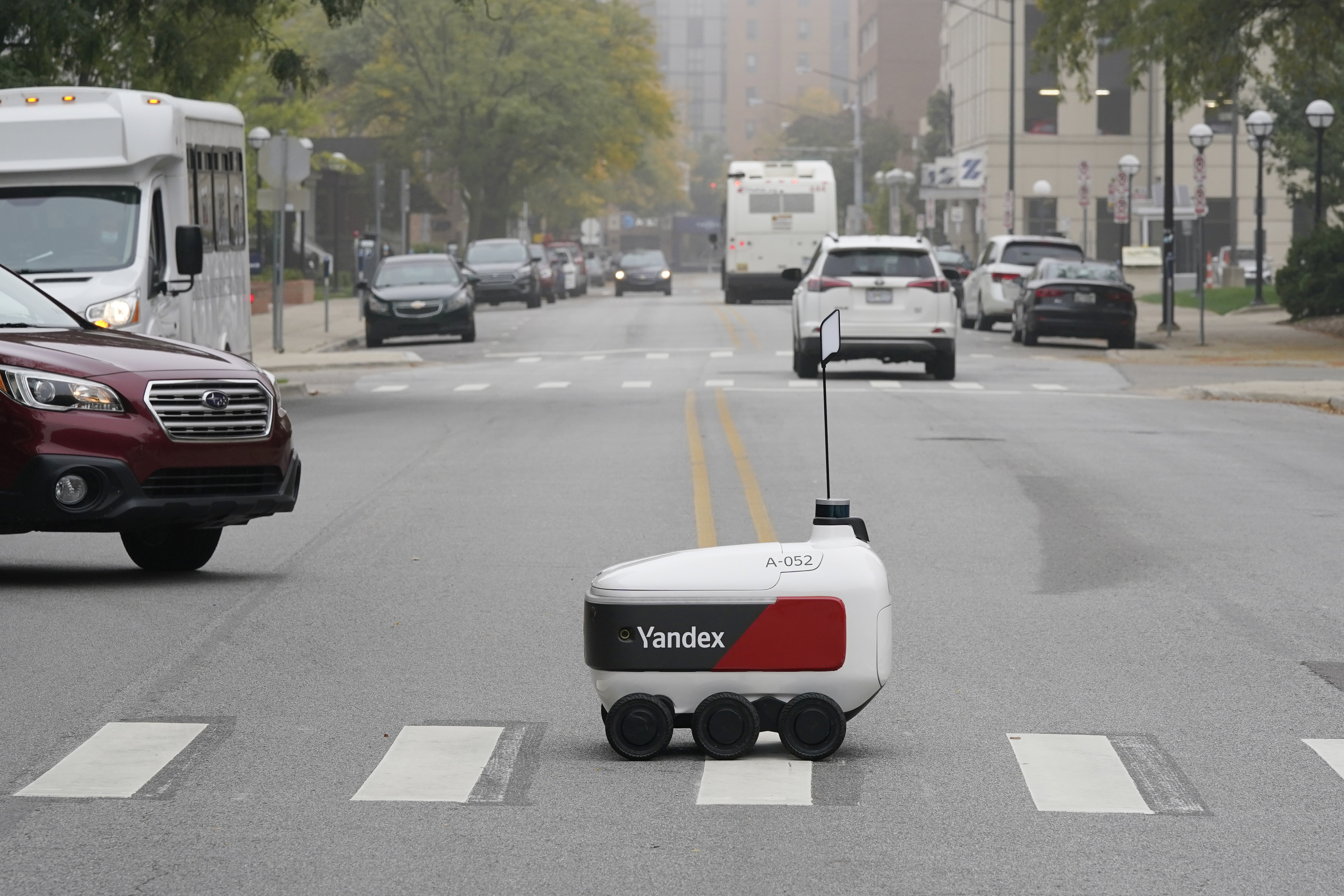 A food delivery robot crosses a street in Ann Arbor, Mich. on Oct. 7. Robot food delivery is no longer the stuff of science fiction. 