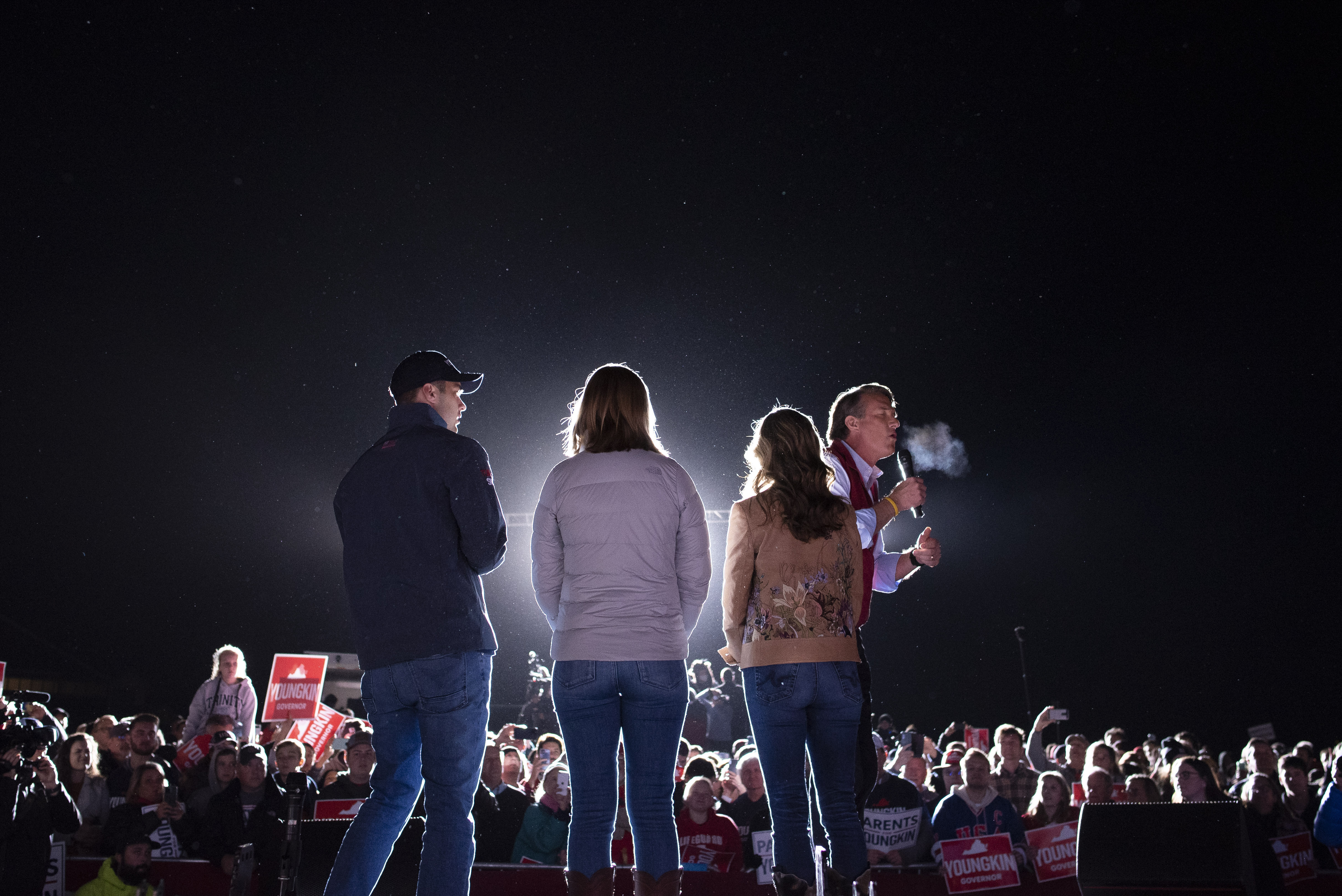 Republican gubernatorial candidate Glenn Youngkin speaks to supporters as his wife Suzanne, right, daughter Anna, center, and son Grant watch, at a campaign rally in Leesburg, Va., on Monday. Youngkin has won Virginia’s governor’s race, a major political turnabout in a state that had been trending increasingly blue.