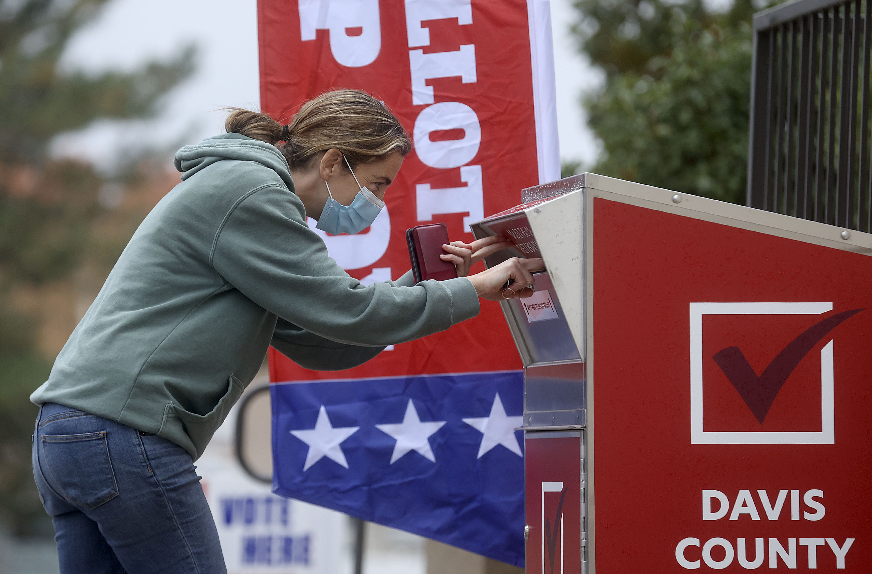 Annie Edwards, of Bountiful, drops off her ballot outside of the Davis County Library's South Davis Branch in Bountiful on Election Day, Tuesday. Preliminary Wasatch Front election results from Salt Lake, Utah, Davis, Weber, Summit and Tooele counties will be updated.