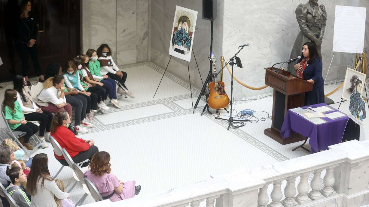 Rep. Angela Romero, D-Salt Lake City, speaks during a press conference to celebrate the 125th anniversary of the first Utah woman elected to public office at the Capitol in Salt Lake City on Wednesday, Nov. 3, 2021. A statue of Dr. Martha Hughes Cannon, the nation’s first female senator who was elected in 1896, is behind her.