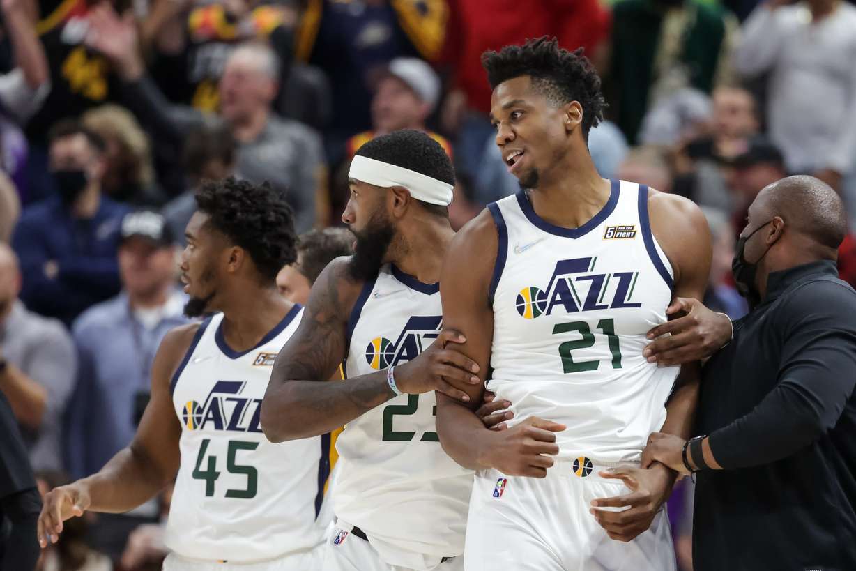 Utah Jazz forward Royce O'Neale (23) pulls center Hassan Whiteside (21) away after a scuffle with Denver Nuggets forward JaMychal Green (0) during the game at Vivint Arena in Salt Lake City on Tuesday, Oct. 26, 2021.