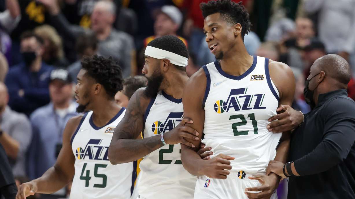 Utah Jazz forward Royce O'Neale (23) pulls center Hassan Whiteside (21) away after a scuffle with Denver Nuggets forward JaMychal Green (0) during the game at Vivint Arena in Salt Lake City on Tuesday, Oct. 26, 2021.
