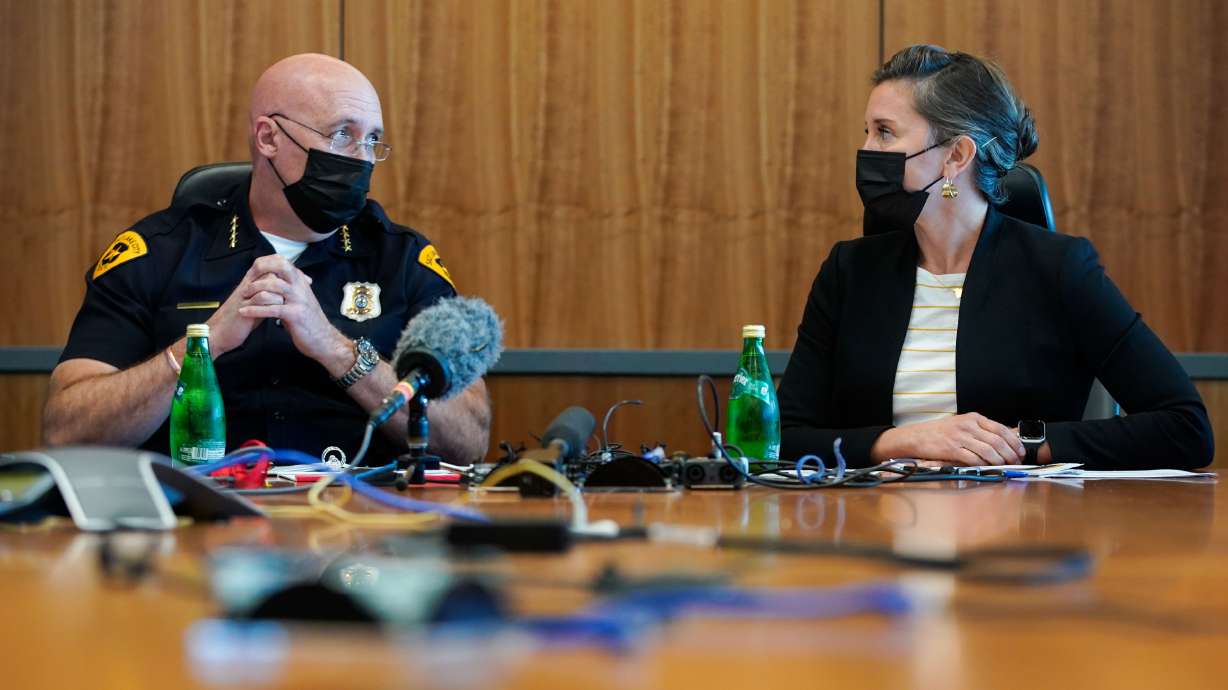 Salt Lake City Police Chief Mike Brown, left, and Salt Lake City Mayor Erin Mendenhall speak during a press conference highlighting the city’s revised crime control plan at the Salt Lake City Public Safety Building on Wednesday.